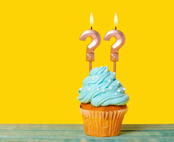 istock Birthday Cake With Two Question Mark Candles 1997495009