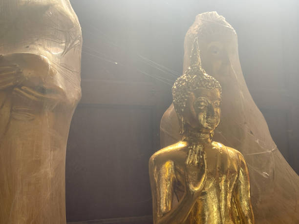 istock Medium shot of Golden Buddha statue in temple 1997510943