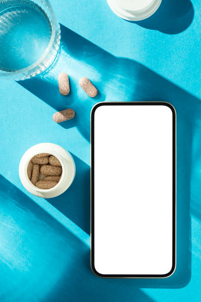 istock Smartphone mockup with tablet pills on blue background 1997531073