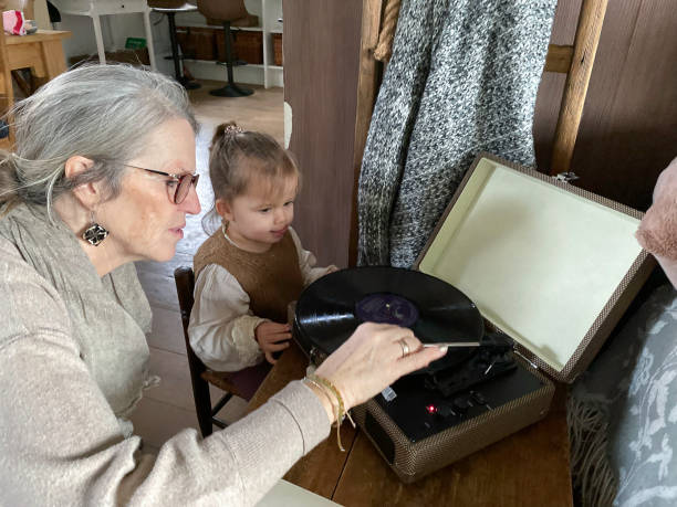 istock Grandmother showing  the turntable 1997542387