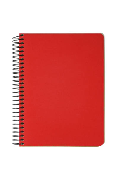 Closed spiral bound notepad with red cover isolated on white background