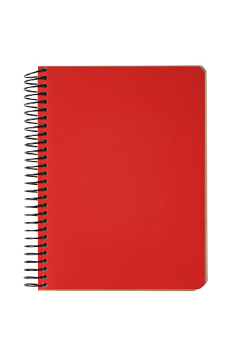 Closed spiral bound notepad with red cover isolated on white background. Top view, copy space for text, template, mockup.