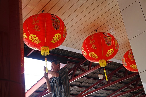 Buddhists clean the monastery to welcome the Chinese New Year, in Banda Aceh City on February 9, 2024.