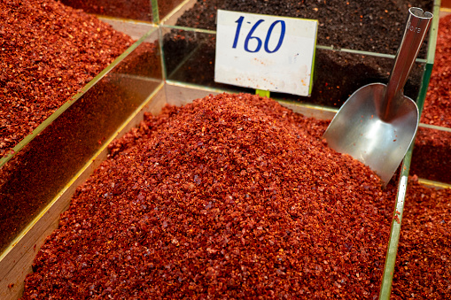 heap of ground dried hot red pepper sold at spice shop