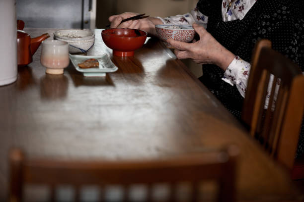 istock Elderly woman eating lonely 1997570001
