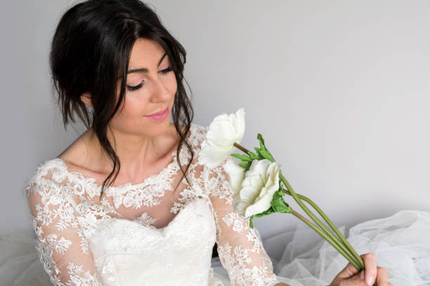 istock Beautiful bride in wedding with bouquet 1997570522