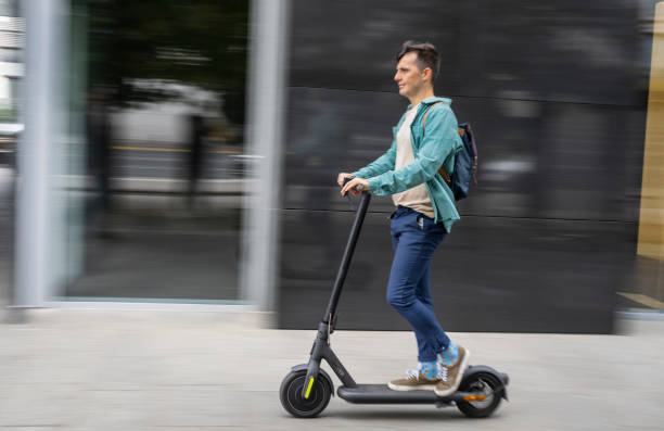 istock Adult Man Riding Electric Scooter, Blurred Motion 1997574250