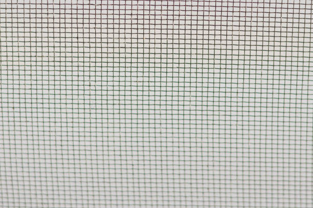 Close up of a wire mesh on a white background.