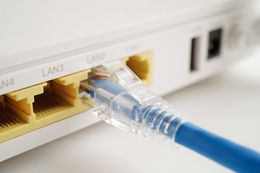 Ethernet cable with wireless router connect to internet service provider network.