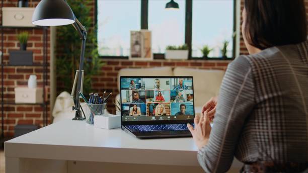 istock Teleworker at home participating in internet videocall with colleagues, 1997623873