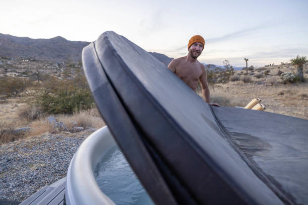 Man uncovers the outdoor tub, ready to soak in He takes some time for himself, self care concept, staycation.
Wellbeing moment in a relaxing environment desert wash stock pictures, royalty-free photos & images