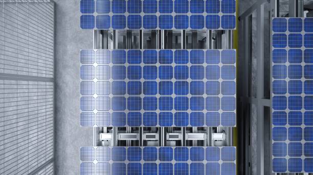 istock Top view of solar panel assembly line operated by high tech robot arms 1997633414