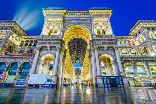 Milan, Italy - January 5, 2022: The Galleria Vittorio Emanuele II at blue hour. It is Italy's oldest active shopping gallery.