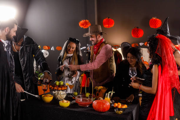 istock Serving red wine to enjoy during a fun Halloween party 1997656149