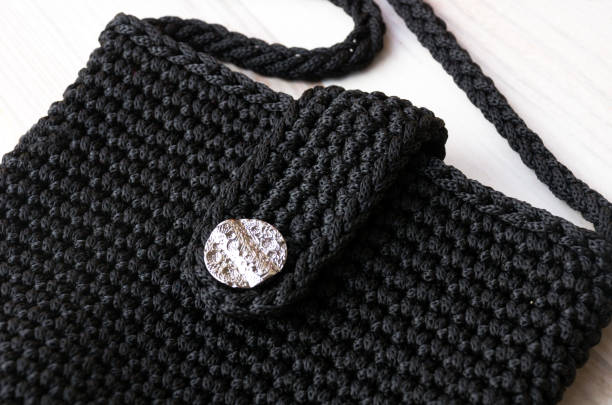 istock Polyester yarn. A small black handbag for the summer. 1997656669