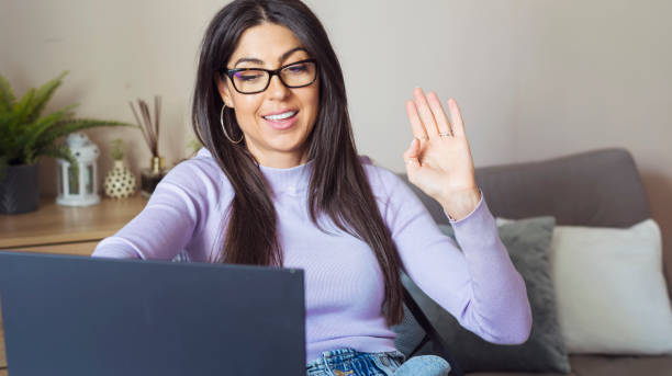 istock Hybrid home type of work . Woman using laptop at home 1997670124