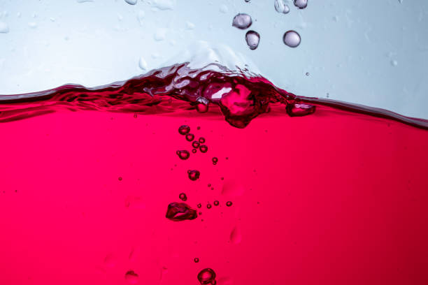 istock Fruit juice in a clear glass bottle There are white background bubbles.. 1997682524