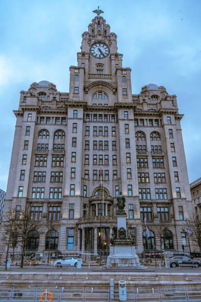 istock Low angle view of building against cloudy sky 1997684590
