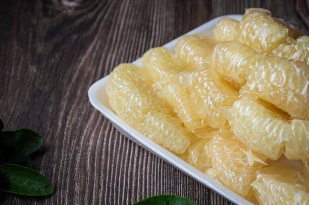 Fresh pomelo has a sweet and sour taste.