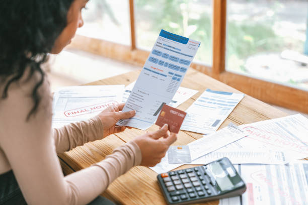 Stressed young woman has financial problems credit card debt to pay crucial Stressed young woman has financial problems with credit card debt to pay crucial show concept of bad personal money and mortgage pay management crisis. financial statement stock pictures, royalty-free photos & images