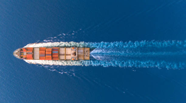 istock Top view Logistics and transportation of Container Cargo ship and Cargo plane with working crane bridge in shipyard at sunrise, logistic import export and transport industry background 1997721789