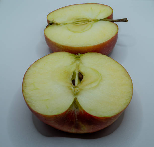 istock sliced ​​yellow apple fruit with visible seeds and insides 1997735027