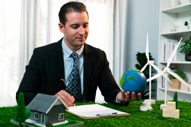 istock Businessman or CEO holding paper globe in office. Quaint 1997764878