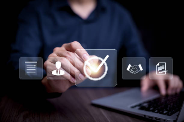 istock Online survey filling out and digital form checklist by laptop computer, Document Management Checking System, online documentation database and process manage files. 1997791552