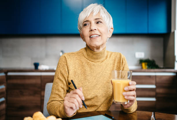 istock Happy senior woman working from home 1997801933
