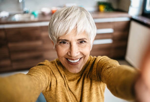 istock Happy senior woman working from home 1997802491