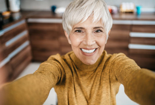 istock Happy senior woman working from home 1997802493