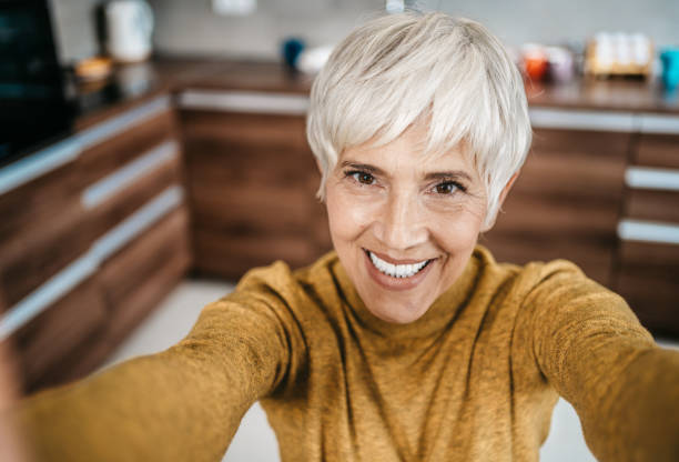 istock Happy senior woman working from home 1997803001