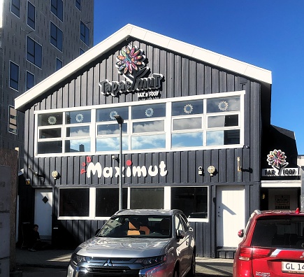 Maximut Restaurant is housed in a structure crafted from black wood.  The photo was taken in Nuuk, Greenland on August 14, 2023.