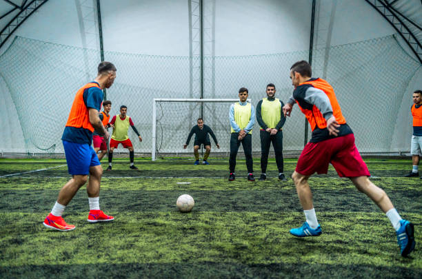 istock Soccer player kicking ball at goal 1997840304