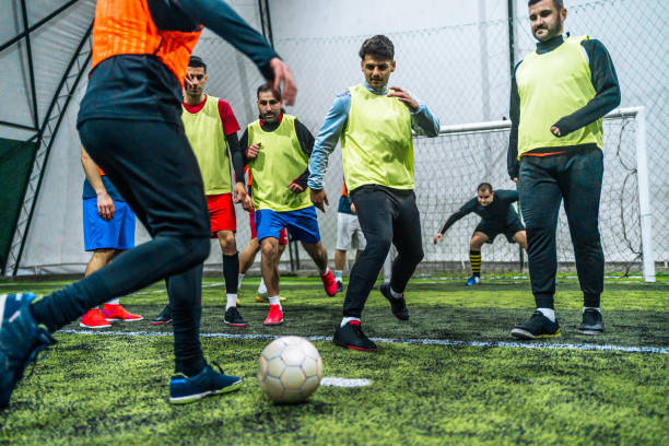 istock Soccer player kicking ball at goal 1997854713
