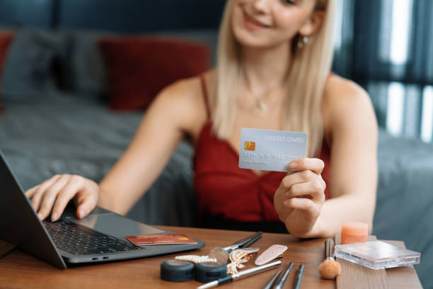 istock Young woman using laptop with credit card for internet banking. Blithe 1997857516