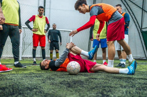 istock Soccer player holding his injured leg 1997864707