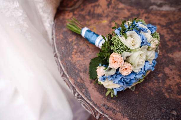 Midsection Of Woman Holding Bouquet