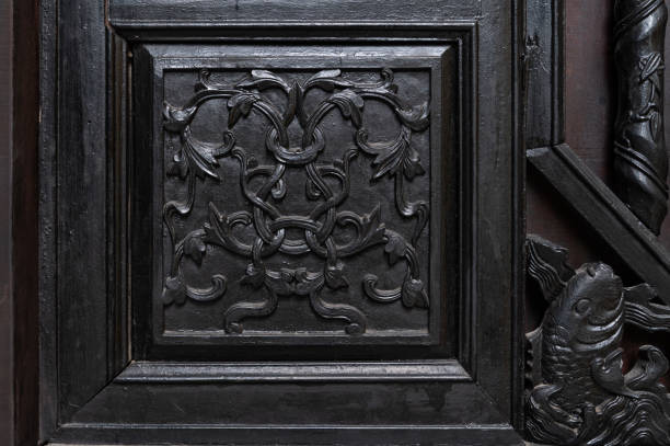 Traditional Vietnamese wooden carvings in Buddhist temples in the UNESCO World Heritage site of Hoi An, Vietnam.