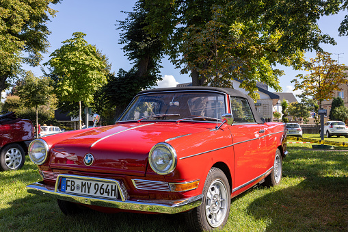 Weiterstadt, Germany September 24, 2023: BMW 700 Cabrio in red at Chromblitz in Weiterstadt at Braunshardt Castle