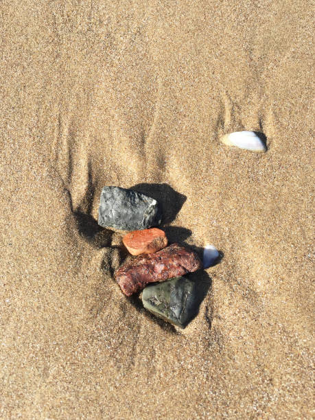 istock Natural stones on sand in beach 1997933529