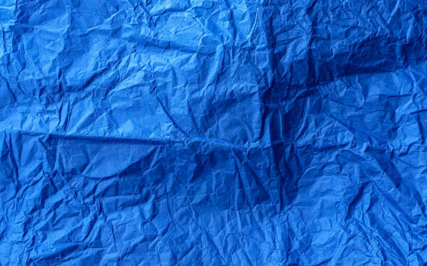istock Crumpled craft tissue paper sheet. Dodgerblue color. 1997934079