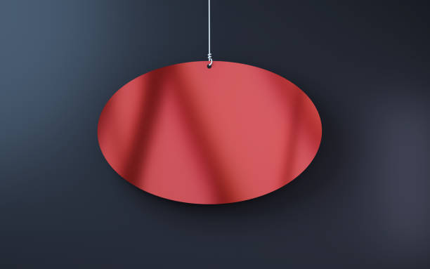 istock Red Metallic Ellipse Note paper hanging on string on black background, Paper Clipping Path 1997955531