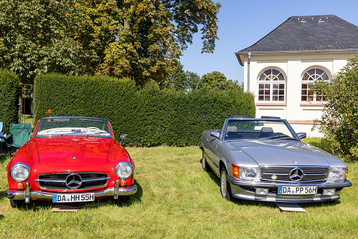 Weiterstadt, Germany September 24, 2023: Mercedes Benz W 121 and Mercedes Benz series 107 at Chromblitz in Weiterstadt at Braunshardt Castle; spoke rims