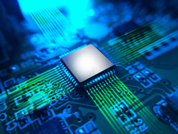 istock The macro photography of microchip mounted on the printed circuit board PCB 1997991266