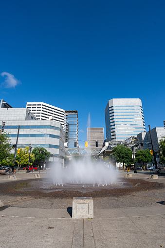 A wide angle photo of Salmon Street Springs Fountain at Tom McCall Waterfront Park in Portland Oregon on a clear summer day.