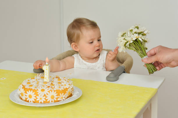 Yellow cake with daisy flowers chamomile for birthday