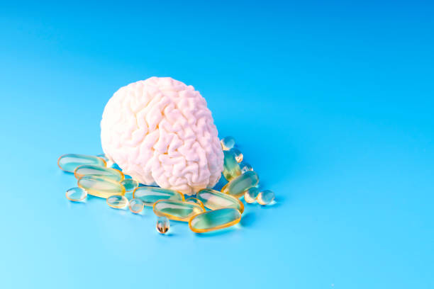istock Concept model of the brain next to omega 3 capsules 1998036934