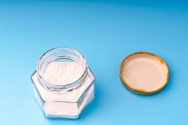 istock White powder in a lined jar on a blue background 1998036940