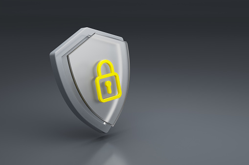 Security, protection and safety. Shield with a padlock - 3d symbol isolated on dark grey background